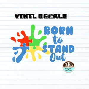 May include: A colorful puzzle piece design with a blue, green, yellow, and red paint splatter. The text "BORN to STAND Out" is written in blue. A small circle with the text "MDG MONTANA DECAL GAL DECALS & STICKERS" is in the bottom right corner.