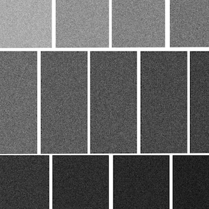 May include: A grayscale image featuring a series of rectangular and square shapes arranged in rows. The shapes vary in shades of gray, ranging from light to dark, creating a visual gradient. The image has a grainy texture.
