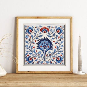 May include: A framed print of a blue and red floral design on a white background. The design features a central flower with intricate details and surrounding foliage.