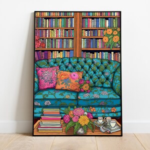 May include: A teal blue floral patterned couch with two pillows, one pink and one orange, sits in front of a bookshelf filled with books. A vase of flowers sits on a table in front of the couch with two cups and saucers.