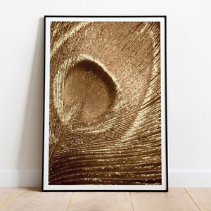May include: Abstract art print featuring a swirling pattern of gold and brown lines, creating a sense of depth and movement.