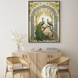May include: A framed illustration of two peacocks in a garden setting. The peacocks are blue and green with long, flowing tails. The garden is filled with flowers and trees. The frame is black and has a decorative border.