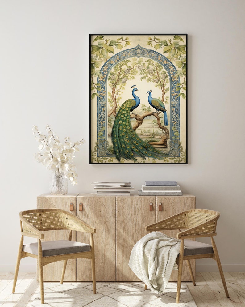 May include: A framed illustration of two peacocks in a garden setting. The peacocks are blue and green with long, flowing tails. The garden is filled with flowers and trees. The frame is black and has a decorative border.