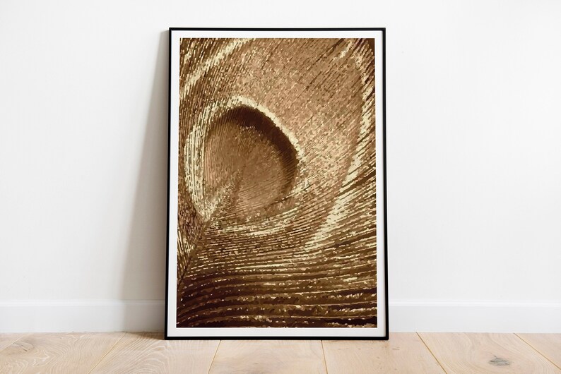 May include: Abstract art print featuring a swirling pattern of gold and brown lines, creating a sense of depth and movement.