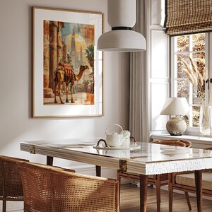 May include: A dining room with a white marble table and four wicker chairs. A white pendant light hangs above the table. A framed print of a camel in front of a building is on the wall.
