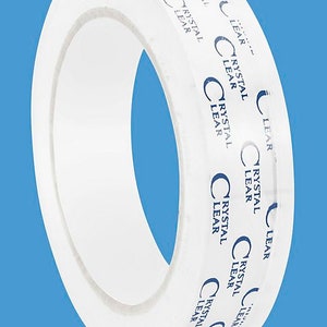 May include: A roll of clear packing tape with the text "Crystal Clear" printed on the side.
