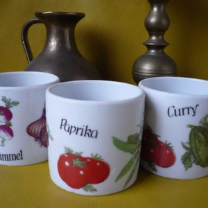 Porcelain spice jars for curry, paprika and caraway seeds. Vintage, Germany