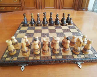 Handmade wooden chessboard with pieces. Vintage from Austria.