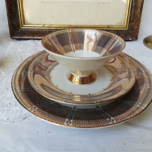 Three-piece tea service. Cup, saucer and plate. Vintage Germany