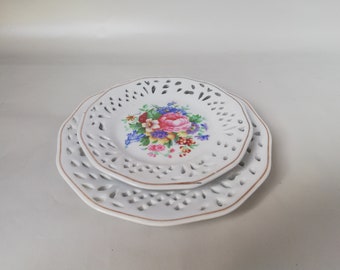 Vintage porcelain decorative plate set with gold rim and flower bouquet for wall decoration, showcase jewelry or as a gift idea