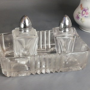 Old glass salt and pepper shakers. Vintage from Austria