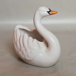 Vintage flower pot in the shape of a swan for that special charm
