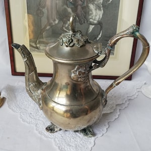 Silver-plated teapot, richly decorated with relief decoration, vintage