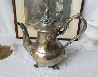Silver-plated teapot, richly decorated with relief decoration, vintage