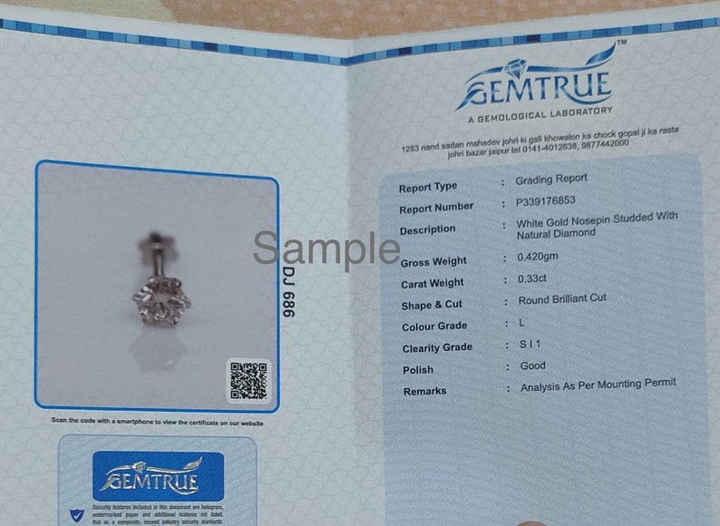 May include: A Gemtrue grading report for a white gold nosepin featuring a round brilliant cut natural diamond. The document lists a gross weight of 0.420gm, a carat weight of 0.33ct, color grade L, and clarity grade SI1, with report number P339176853.