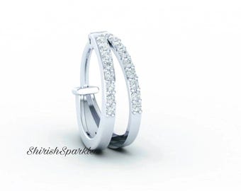 May include: Silver hoop earrings with a double row of small diamonds.
