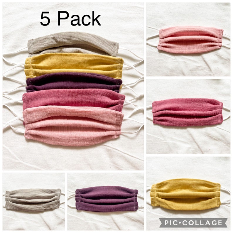 May include: A 5 pack of reusable face masks in a variety of colors, including gray, yellow, purple, pink, and light pink. The masks are made of a soft, breathable fabric and have a pleated design.