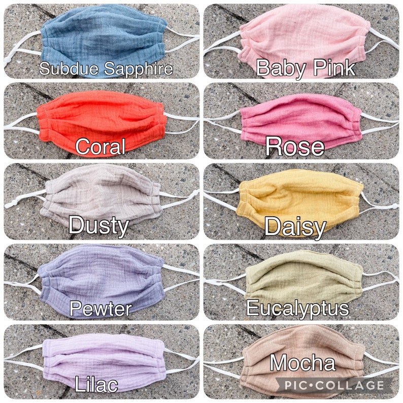 May include: A collage of 10 different colored fabric face masks. The colors are: Subdue Sapphire, Baby Pink, Coral, Rose, Dusty, Daisy, Pewter, Eucalyptus, Lilac, and Mocha.