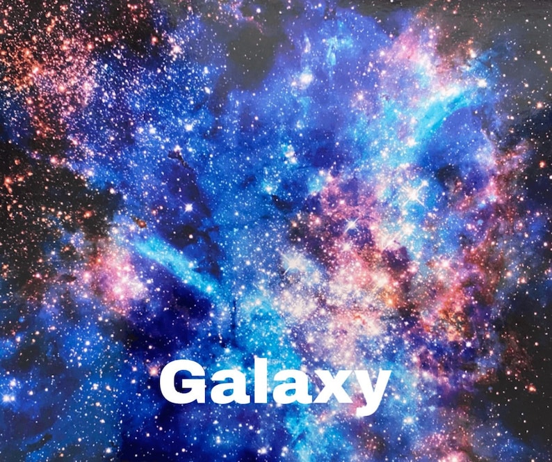 May include: A vibrant galaxy print with a swirling mix of blue, pink, and purple hues. The print features a scattering of white stars and a faint red glow in the centre. The word "Galaxy" is printed in white at the bottom of the image.