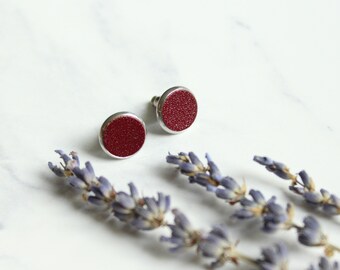 Circle 12 mm dark wine red stud earrings with surgical steel and reused leather by Jenny Aarrekangas