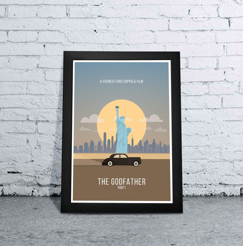 May include: A black framed poster with a minimalist design featuring the Statue of Liberty, a cityscape, and a black car. The poster has the text "A Francis Ford Coppola Film" and "The Godfather Part I".