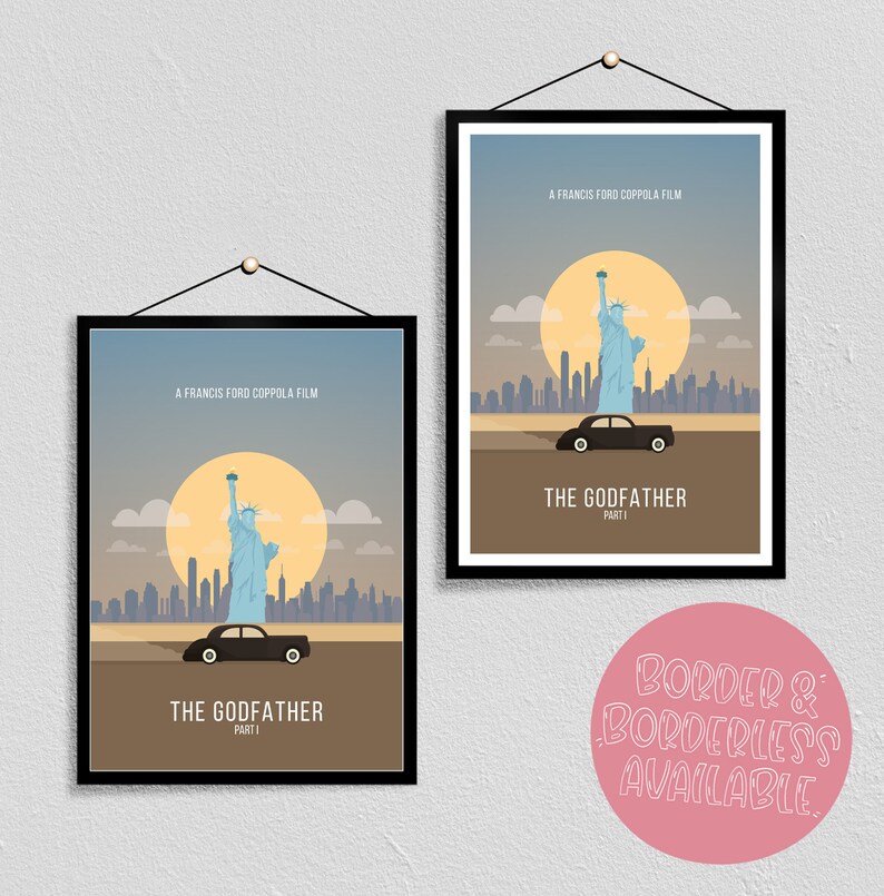 May include: Two black framed posters with a minimalist design featuring a black car driving past the Statue of Liberty in front of a cityscape with a yellow sun. The posters have the text "A Francis Ford Coppola Film" and "The Godfather Part I".