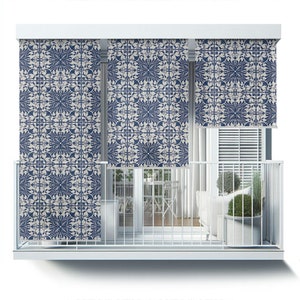 May include: Blue and white patterned window shades with a geometric design. The shades are pulled down to cover the windows of a balcony.