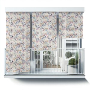 May include: Three white window shades with a floral pattern in shades of pink, blue, and brown. The shades are pulled down to cover the windows on a balcony.