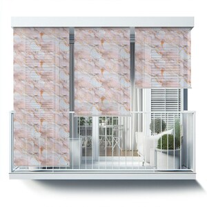 May include: White balcony with a white railing and three pink and gold marble patterned roller shades. The shades are pulled down and cover the windows. There is a white couch and a table with chairs on the balcony.
