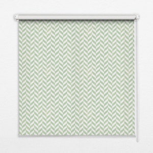 May include: A white roller blind with a green and white chevron pattern.
