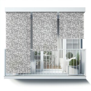 May include: White balcony with three black and white patterned window shades featuring a repeating design of cats. The shades are pulled down to cover the windows. The balcony has a white railing and a white floor. There is a white couch and a table with two chairs on the balcony.
