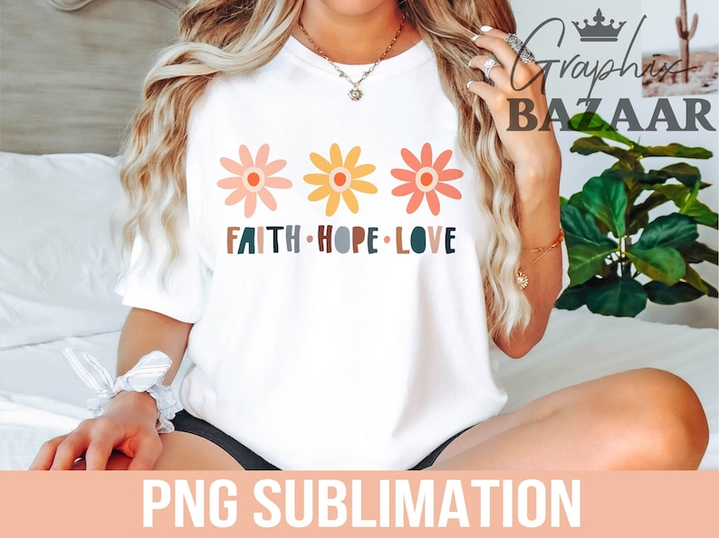 May include: White t-shirt with a graphic of three colorful flowers and the text "Faith Hope Love".