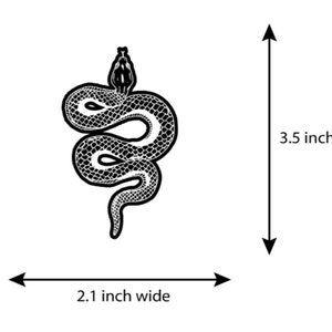May include: Black and white illustration of a snake with its head raised, measuring 2.1 inches wide and 3.5 inches high.
