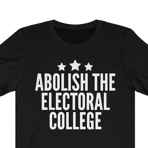 May include: Black t-shirt with the white text "ABOLISH THE ELECTORAL COLLEGE" and three white stars above the text. The shirt is made of a soft material and has short sleeves.