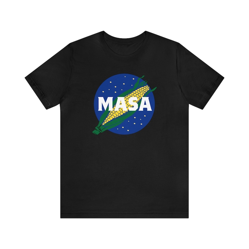 May include: Black t-shirt with a blue and white graphic of a corn cob with the word "MASA" in white letters.
