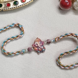 Ganesha Charm Kids Rakhi, Rakhi for Brother/ Sister, Rakshabandhan 2025, Rakhis for Kids, Handmade Hand Bracelet, 100% Cotton Thread Rakhi