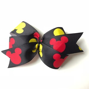 Mickey Mouse rote und Gelbe Schleife