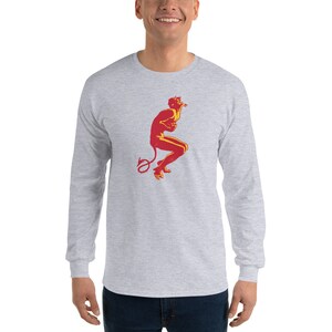 May include: A gray long-sleeve t-shirt with a red and yellow illustration of a devil figure with a curled tail.