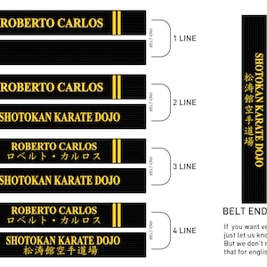 May include: A black and gold karate belt with the text "ROBERTO CARLOS" and "SHOTOKAN KARATE DOJO" in yellow. The belt is shown in four different configurations, with the text arranged in one, two, three, and four lines. The text "BELT END" is also shown in the image.