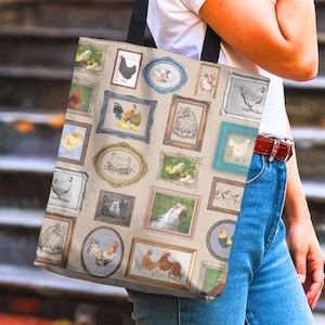 May include: A beige tote bag featuring a collage of framed chicken illustrations in various styles. The frames are in different colors and shapes, with images of chickens, chicks, and eggs. The bag has black straps.