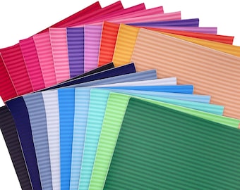 May include: A collection of 20 faux leather sheets with a striped pattern in various colors, including red, pink, purple, blue, green, and orange. The sheets are arranged in a fan shape, with the green sheet at the bottom. The sheets are all the same size and have a smooth, textured surface. The text "CRAFTYrifiC" is visible in the lower left corner of the image.