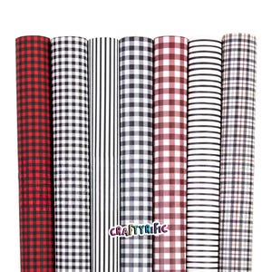 May include: A collection of rolled patterned craft paper rolls. The patterns include red and black buffalo check, black and white gingham, black and white stripes, black and white check, burgundy and white check, white and black stripes, and black and white plaid.