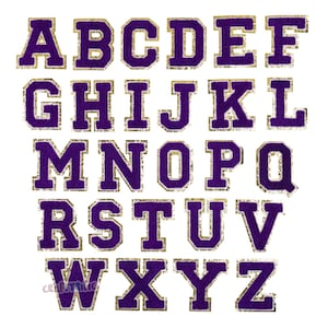 May include: Purple felt alphabet letters with gold glitter trim. Each letter is approximately 2 inches tall.