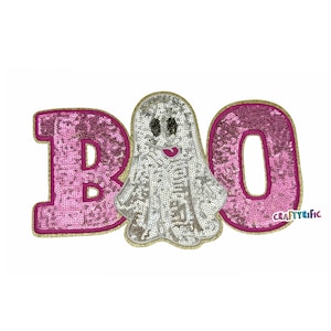 May include: A sequined Halloween applique featuring the word "BOO" with a smiling ghost in the center. The letters are pink with gold trim, and the ghost is silver. The applique is designed for crafting and DIY projects.