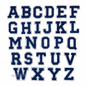 May include: A set of 26 uppercase letters in a navy blue felt with a silver glitter outline. The letters are in a block font style.