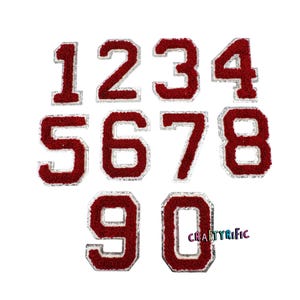 May include: Ten iron-on patches featuring the numbers 1 through 10 in a red and white varsity style font. The patches are perfect for adding a personalized touch to clothing, bags, or other fabric items.