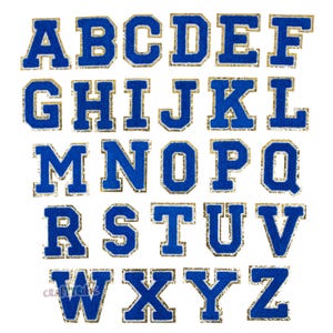 May include: A full alphabet of blue felt letters with gold glitter trim. The letters are in a classic varsity style, perfect for crafting or personalization projects. The letters are displayed on a white background.