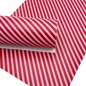 May include: Red and pink diagonal striped faux leather sheet.