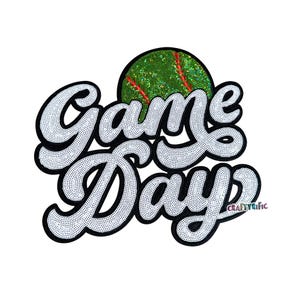 May include: A white sequined "Game Day" patch with a black outline and a green sequined baseball with red stitching. The patch has a cursive font and is on a white background.