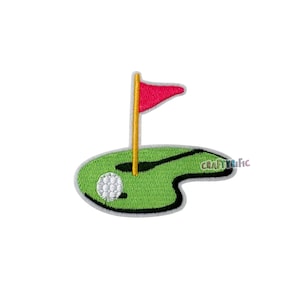 May include: Embroidered patch featuring a golf green with a white golf ball and a red flag on a yellow pole. The patch has a green background with a black outline and the text "CraftyTirific".